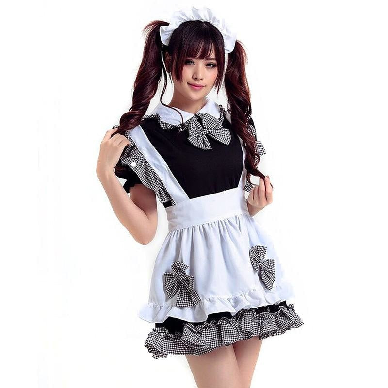 Woman in sassy traditional maid cosplay with pigtails and frilly apron at DDLG playground