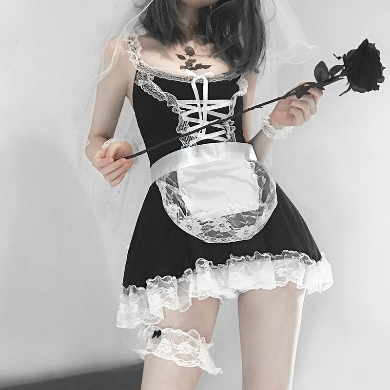 French maid in sweet traditional lacy dress holding black rose from DDLG Playground collection