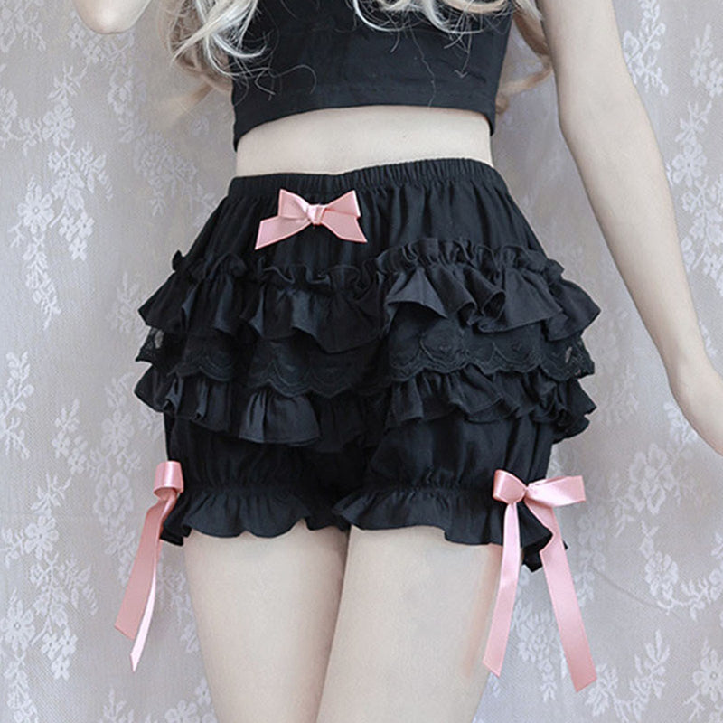 Black ruffled skirt with pink bow accents.