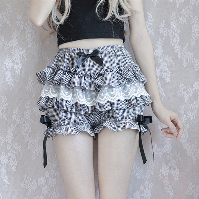 Frilly black and white gingham skirt with lace trim and ribbon bows.