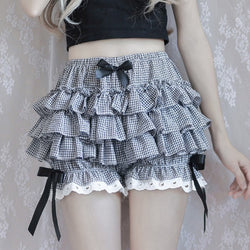 Ruffled gingham skirt with black bows and white lace trim.