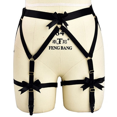 Black harness-style garter belt with bow details and adjustable straps.