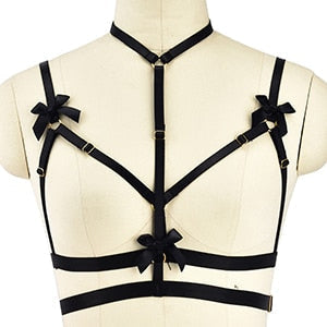 Black strappy harness-style lingerie top with decorative bows.