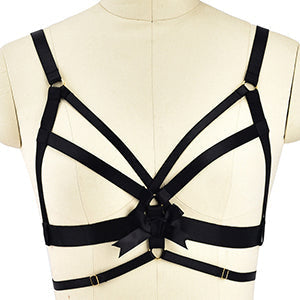Black strappy harness-style bra with geometric design.