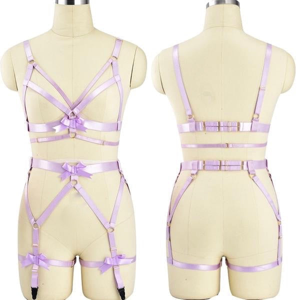 Lavender satin strappy lingerie set with bra top and garter belt displayed on mannequin forms.