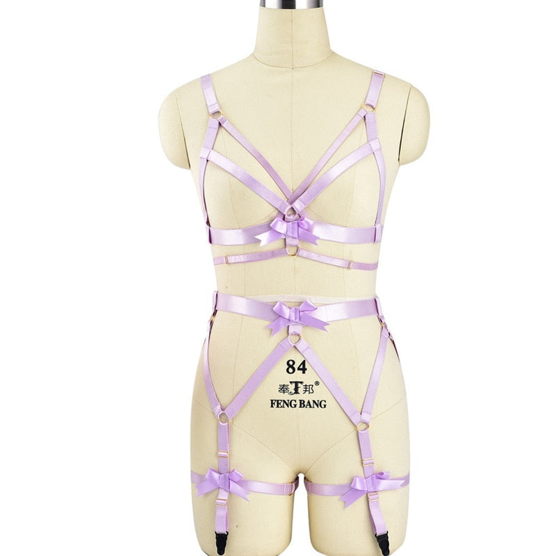 Lavender strappy lingerie set with bows displayed on a mannequin torso.