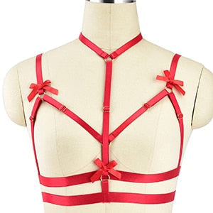 Red strappy harness-style lingerie top with bow details.